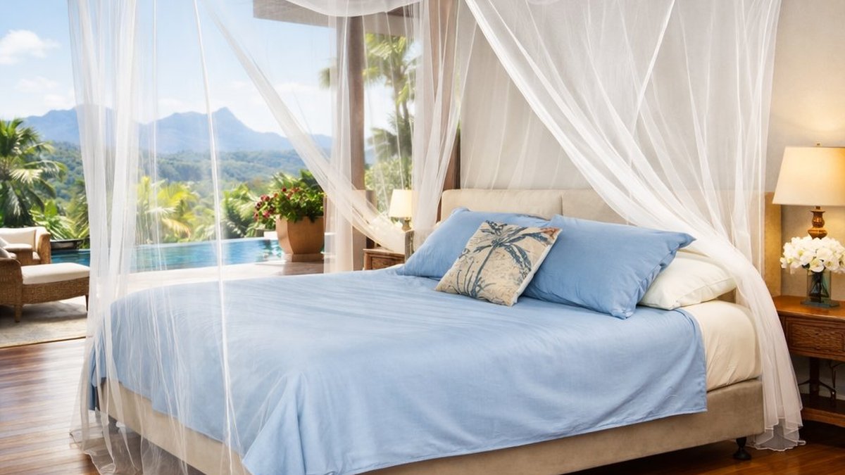 Box mosquito net over a king bed at a tropical resort — MosquitoNets.com