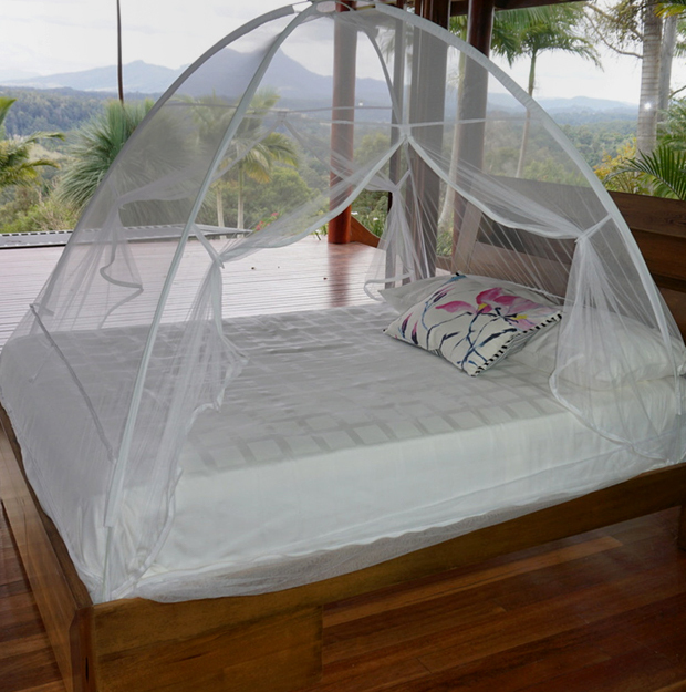 Pop up freestanding mosquito net on a double bed
